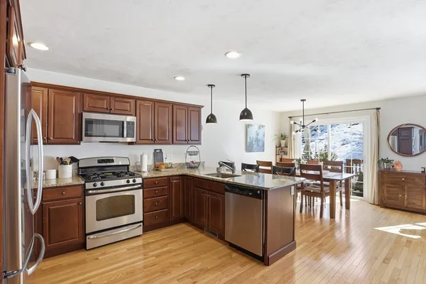 a kitchen with lots of counter top space and appliances