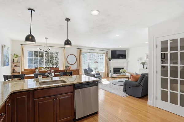 a living room with furniture a window and flat screen tv