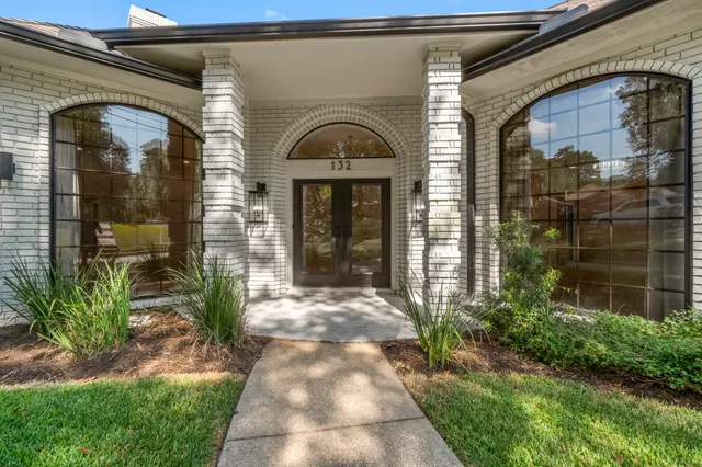 a front view of a house with a glass door