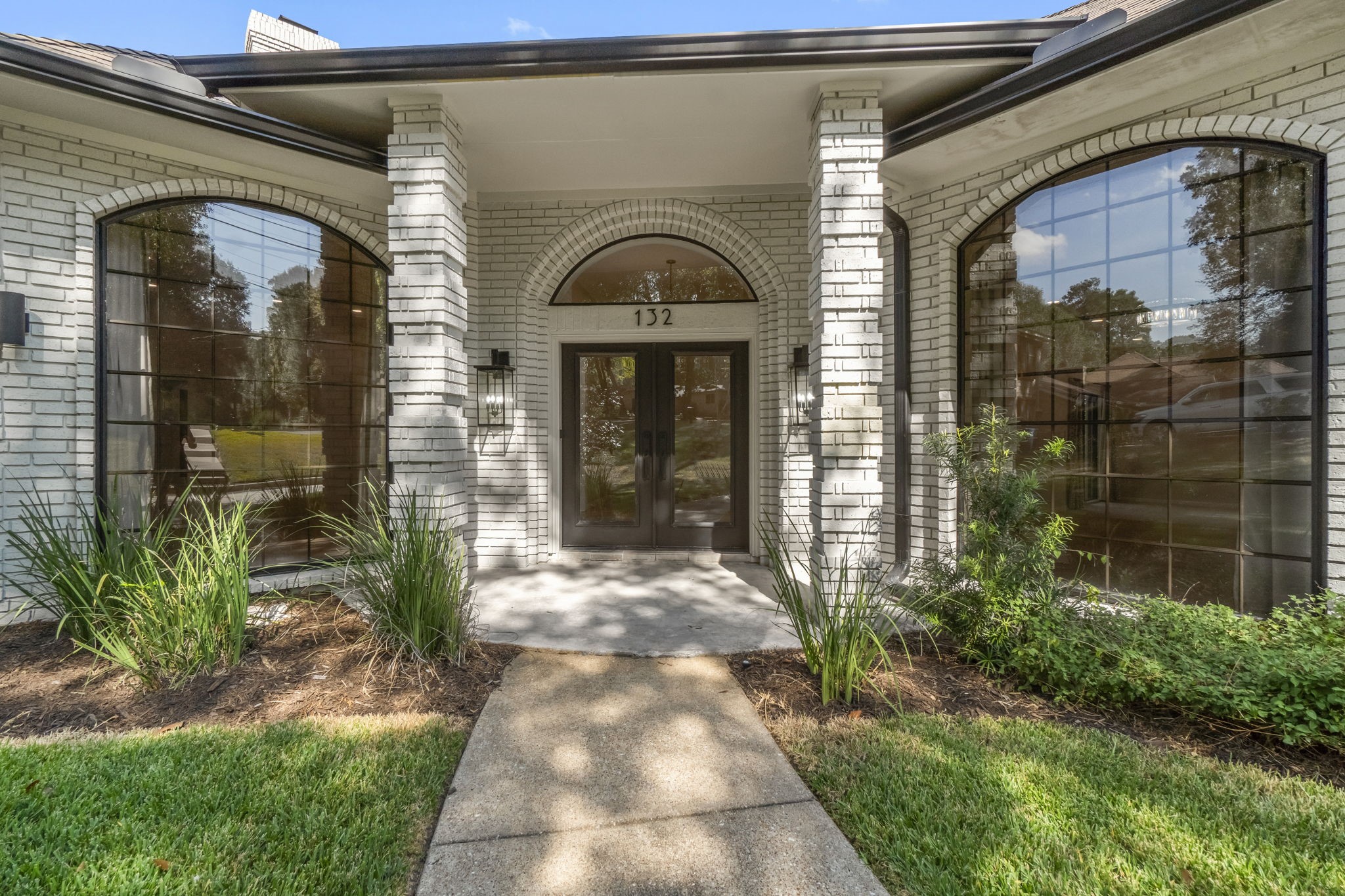 132 Mockingbird Lane Livingston, TX 77351 - Photo 2 of 50 a front view of a house with a glass door