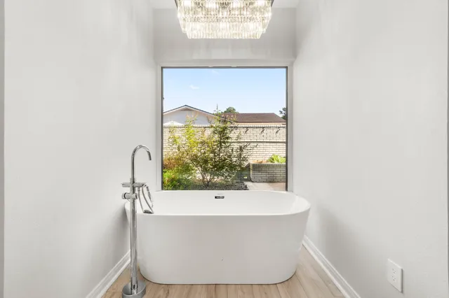 a view of an empty room with a fireplace