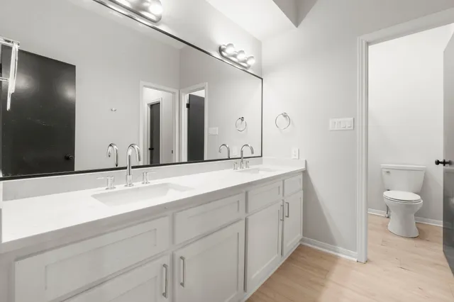 a view of a big house with a big yard and large trees