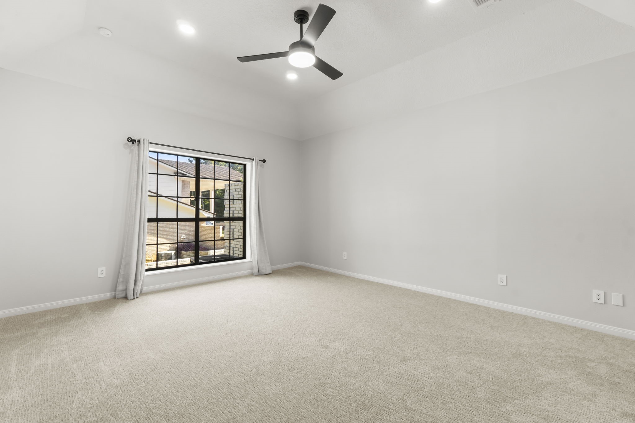 132 Mockingbird Lane Livingston, TX 77351 - Photo 35 of 50 an empty room with windows and fan