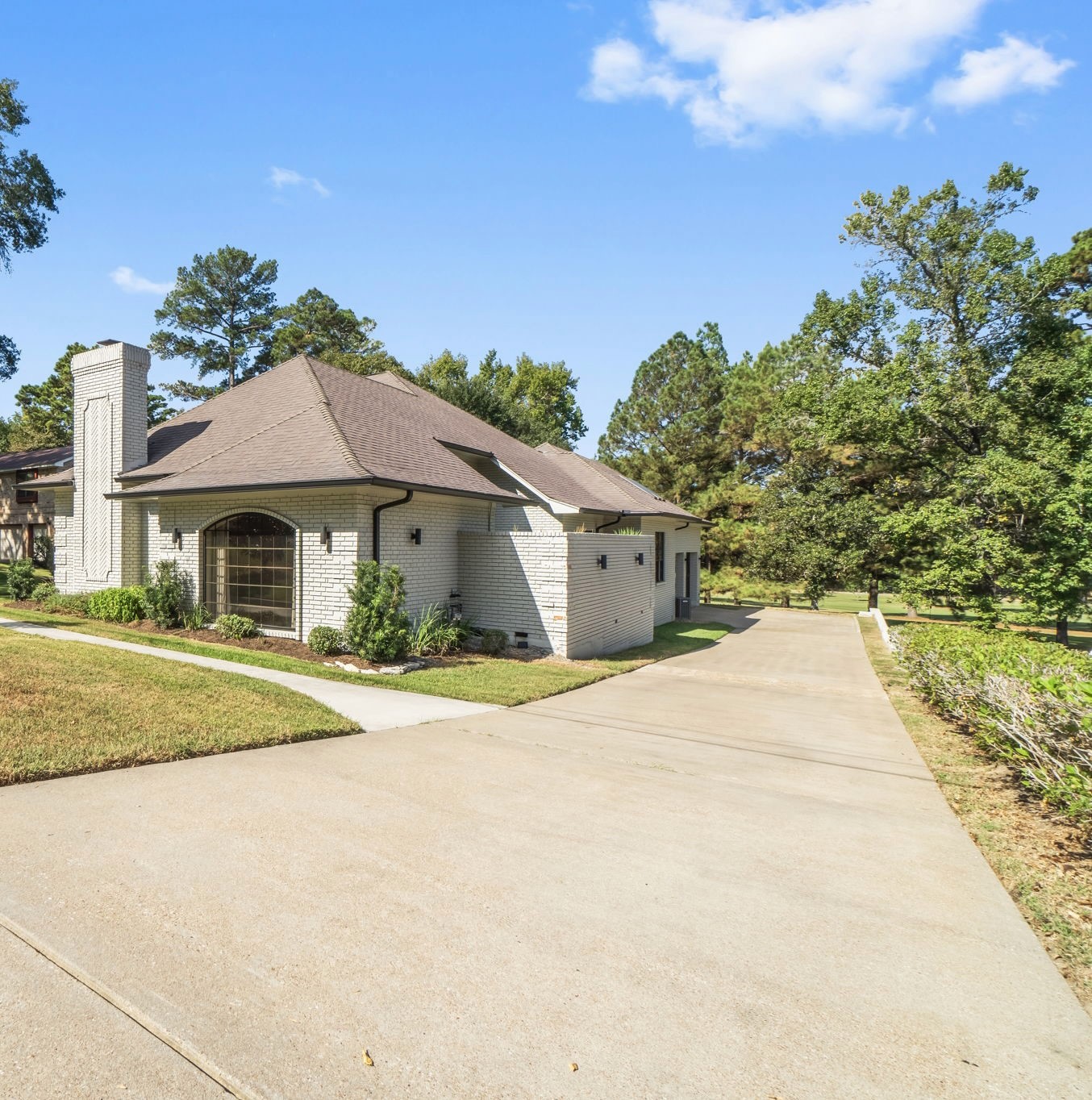 132 Mockingbird Lane Livingston, TX 77351 - Photo 48 of 50 a front view of a house with a yard and garage