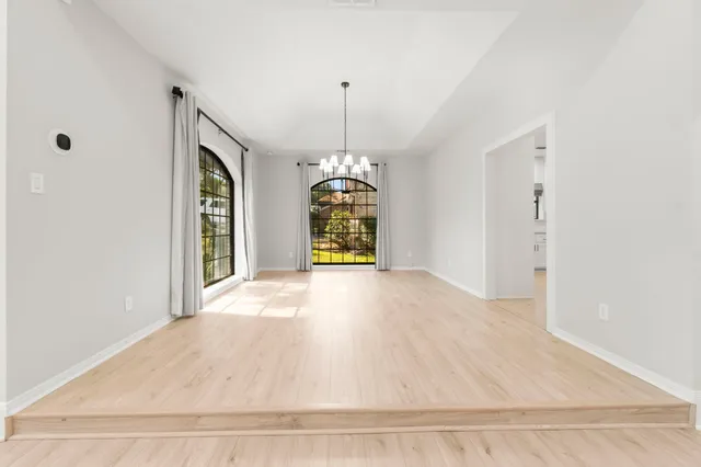 a view of an empty room with a balcony