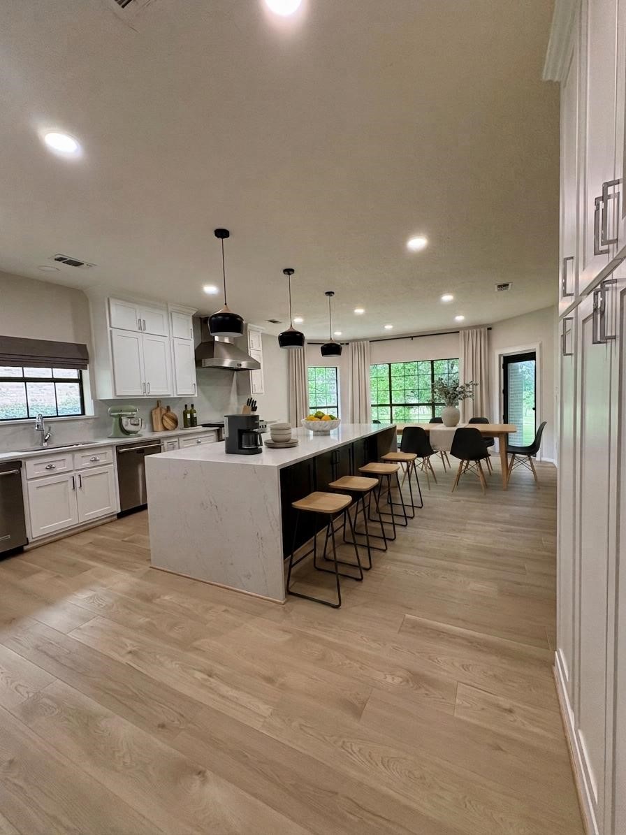 132 Mockingbird Lane Livingston, TX 77351 - Photo 10 of 50 a large white kitchen with lots of counter space and a sink