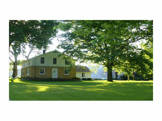 a view of a house with a big yard