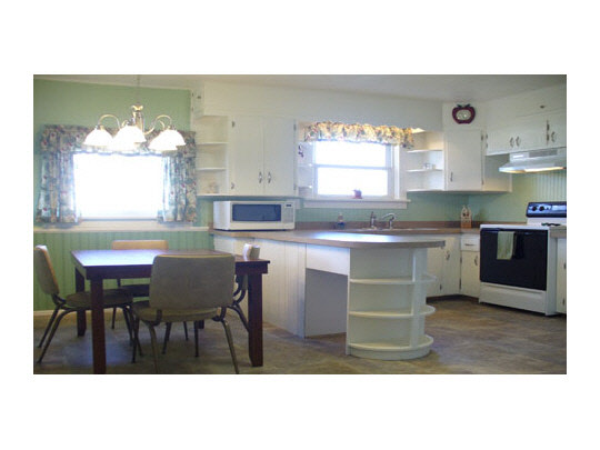 15236 Prairie Road South Beloit, IL 61080 - Photo 4 of 11 a kitchen with a table chairs and a window