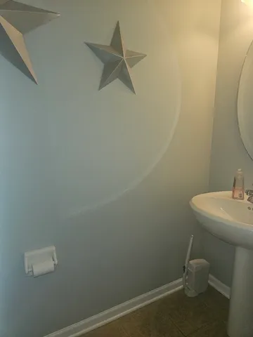a bathroom with a sink and toilet