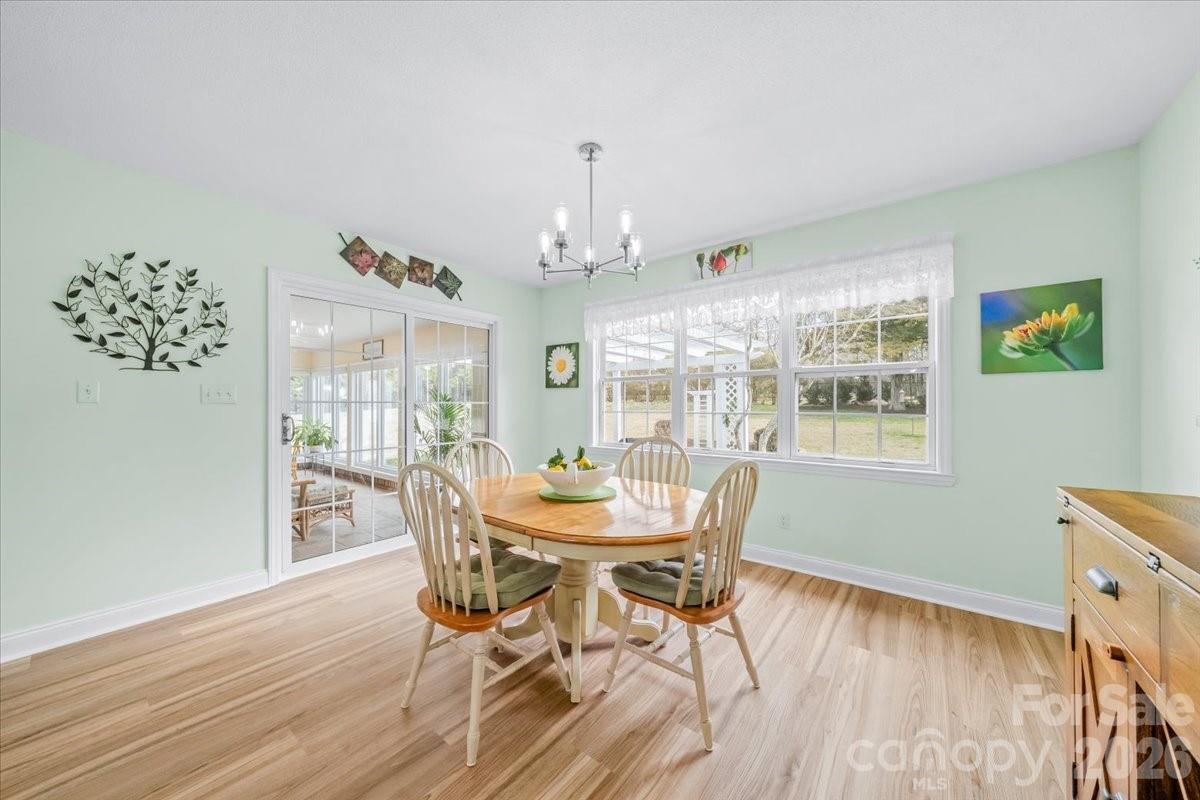 16601 Jefferson Place Fort Mill, SC 29708 - Photo 17 of 45 a view of a dining room with furniture window and wooden floor