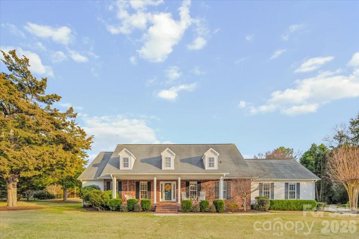 16601 Jefferson Place Fort Mill, SC 29708 - Photo 2 of 45 a front view of residential houses with yard and green space