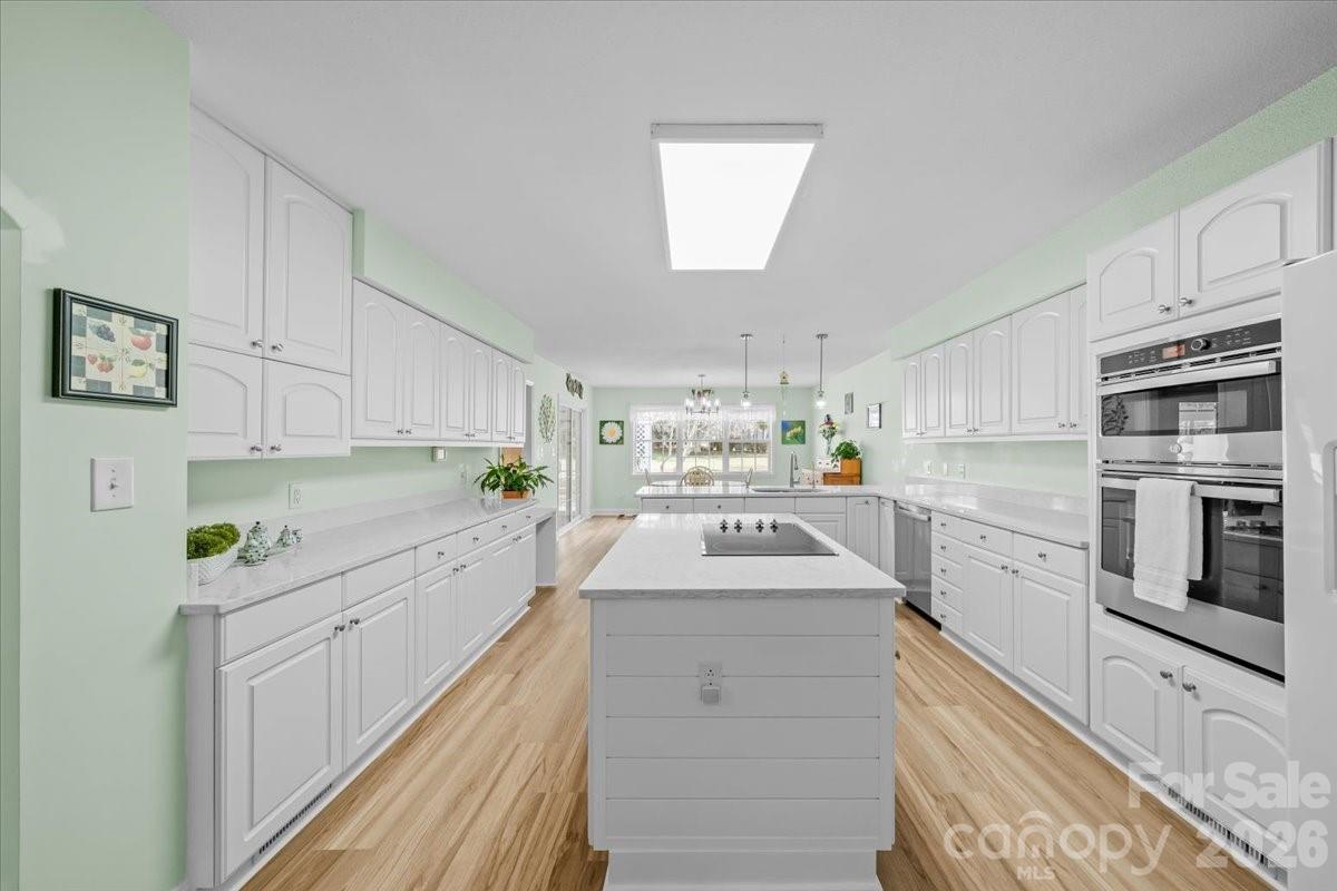 16601 Jefferson Place Fort Mill, SC 29708 - Photo 21 of 45 a kitchen with cabinets stainless steel appliances and a counter space