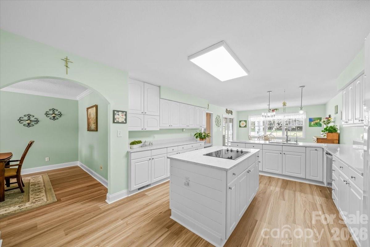 16601 Jefferson Place Fort Mill, SC 29708 - Photo 22 of 45 a kitchen with cabinets and wooden floor