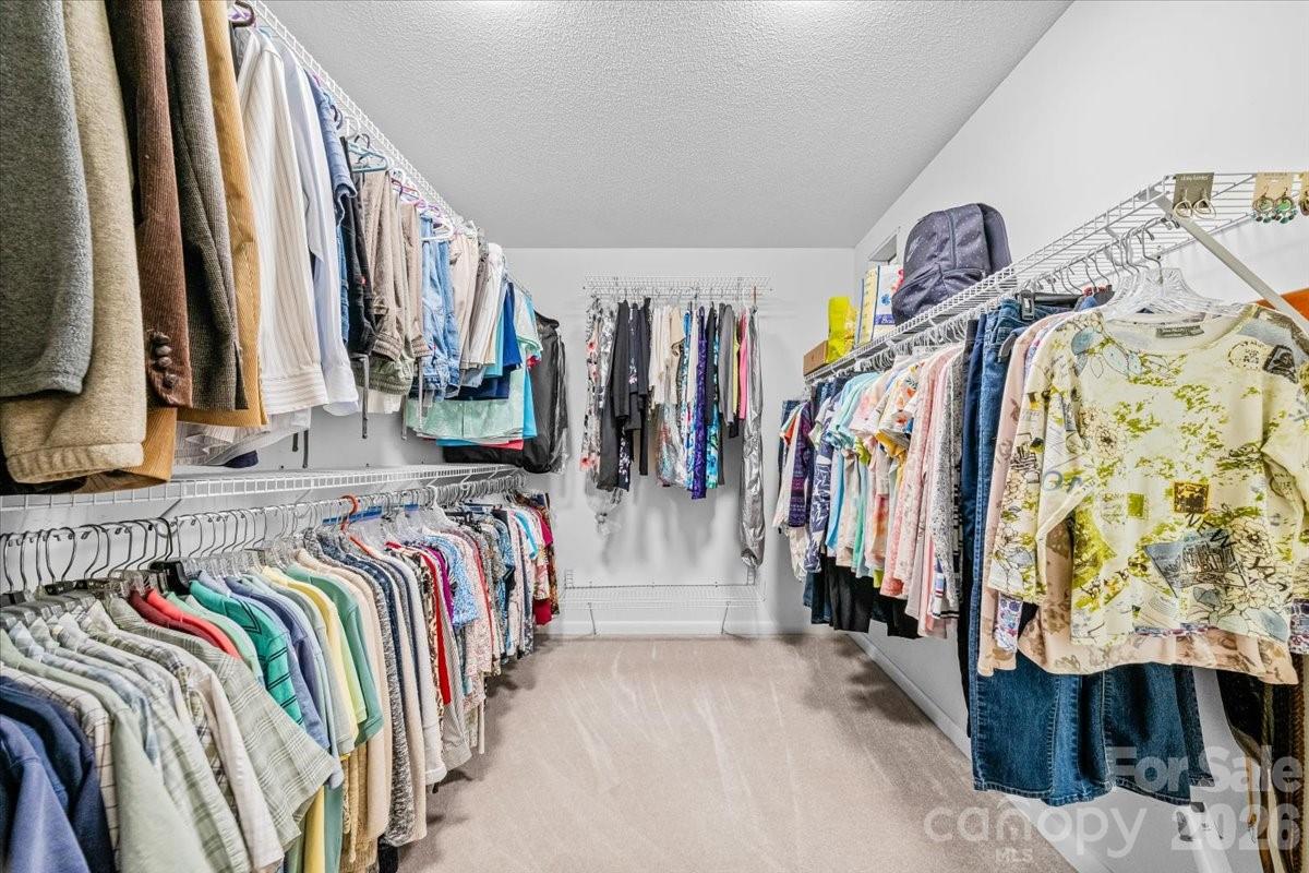 16601 Jefferson Place Fort Mill, SC 29708 - Photo 29 of 45 a view of walk in closet with clothes and shoes