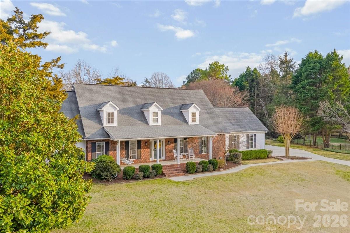 16601 Jefferson Place Fort Mill, SC 29708 - Photo 3 of 45 a view of a house with a yard and potted plants