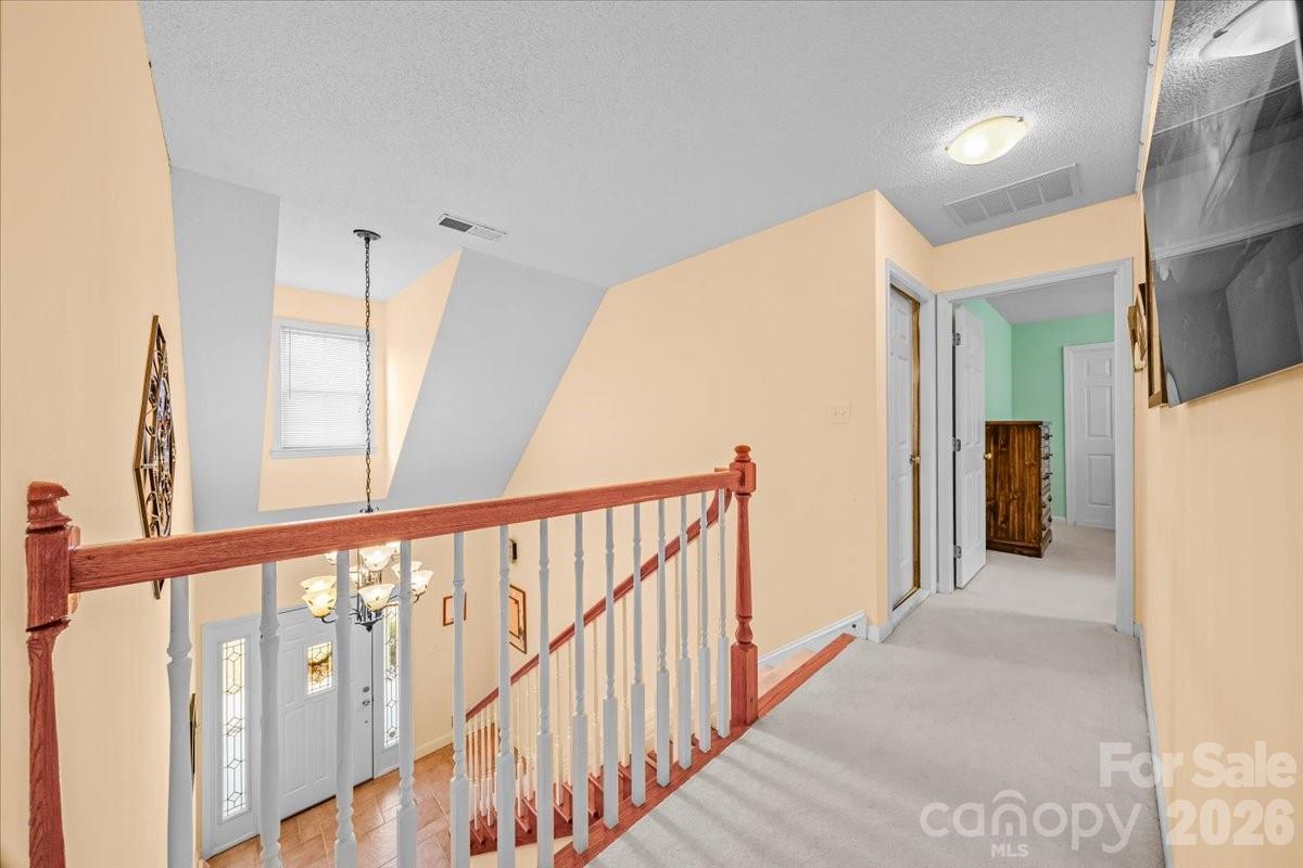 16601 Jefferson Place Fort Mill, SC 29708 - Photo 31 of 45 a view of a hallway with staircase