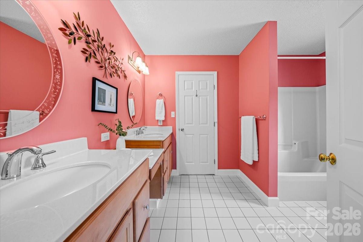 16601 Jefferson Place Fort Mill, SC 29708 - Photo 34 of 45 a bathroom with a sink vanity and a mirror