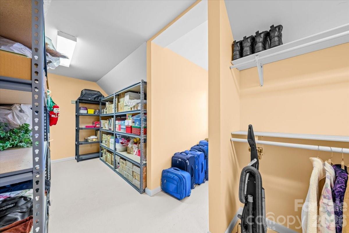 16601 Jefferson Place Fort Mill, SC 29708 - Photo 38 of 45 a view of walk in closet with clothes and shoes