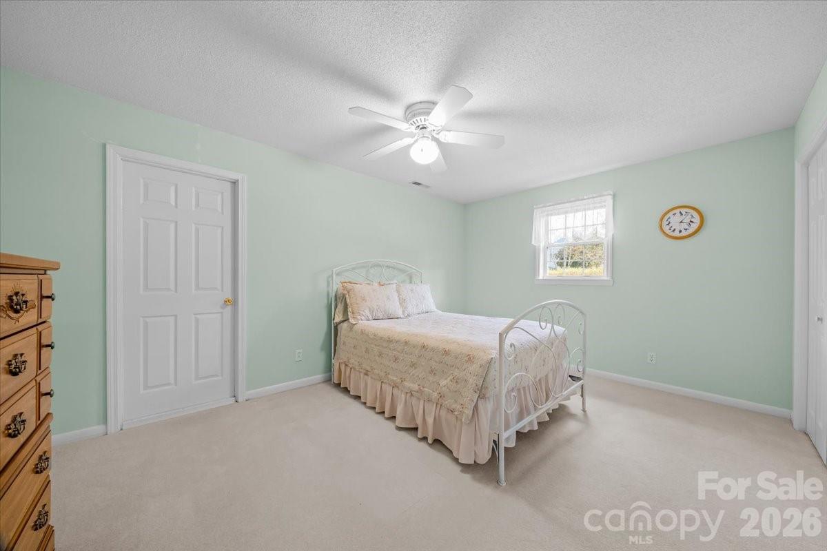 16601 Jefferson Place Fort Mill, SC 29708 - Photo 39 of 45 a bedroom with a bed and a window
