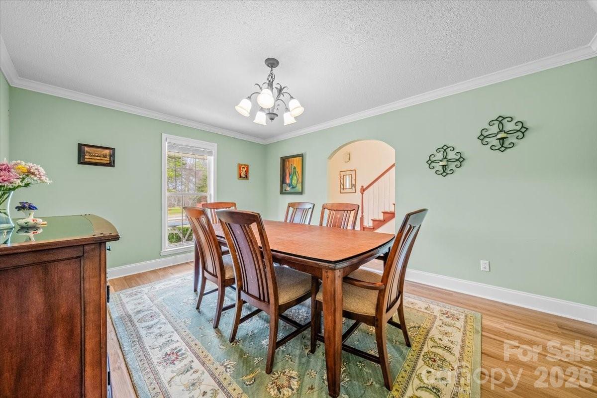 16601 Jefferson Place Fort Mill, SC 29708 - Photo 10 of 45 a view of a dining room with furniture window and wooden floor