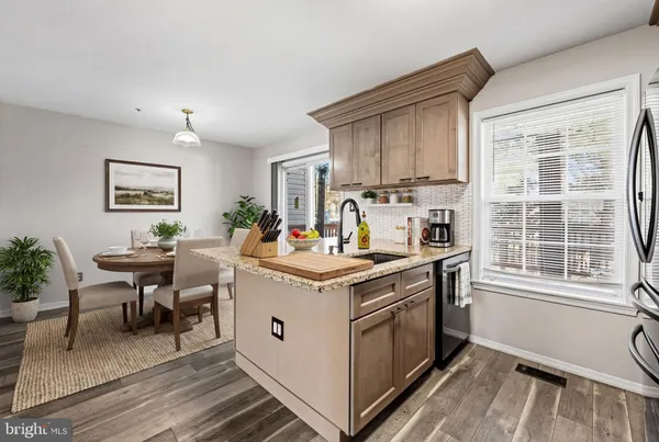 a kitchen with a stove and a window