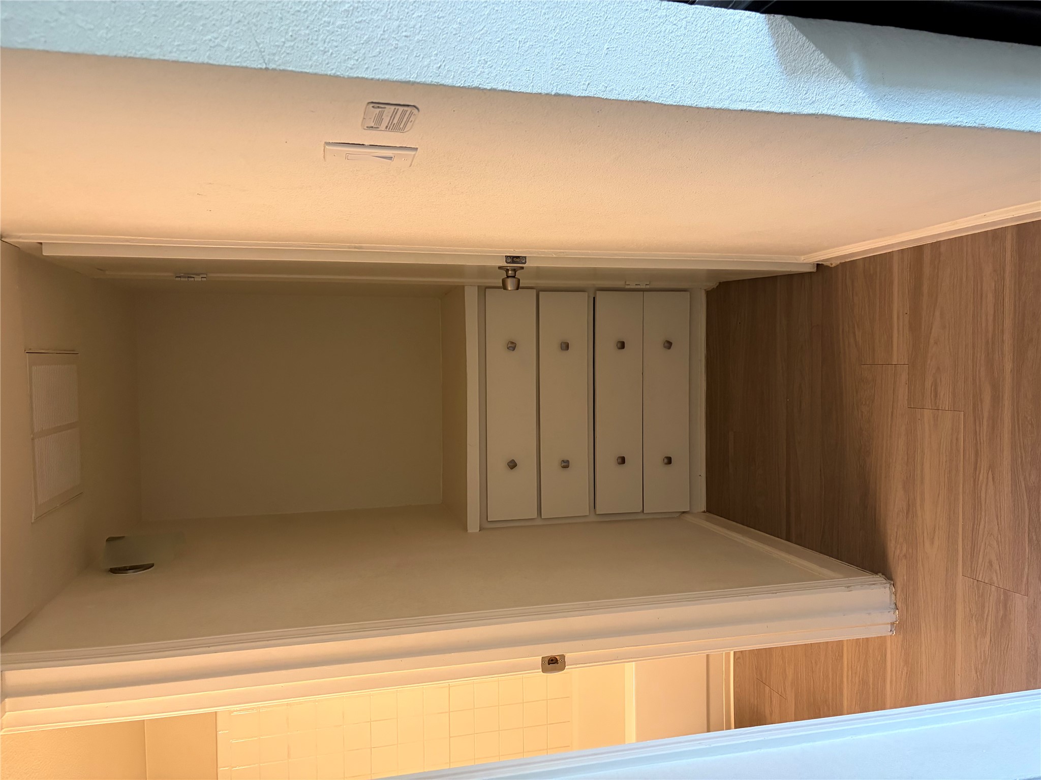 4501 Speedway, Unit 101 Austin, TX 78751 - Photo 3 of 7 A clever, space-saving closet solution features built-in drawers and durable vinyl plank flooring.