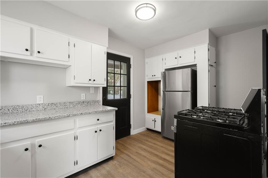 1613 Clarkton Street Pittsburgh, PA 15204 - Photo 10 of 23 a kitchen with stainless steel appliances granite countertop a refrigerator and a stove