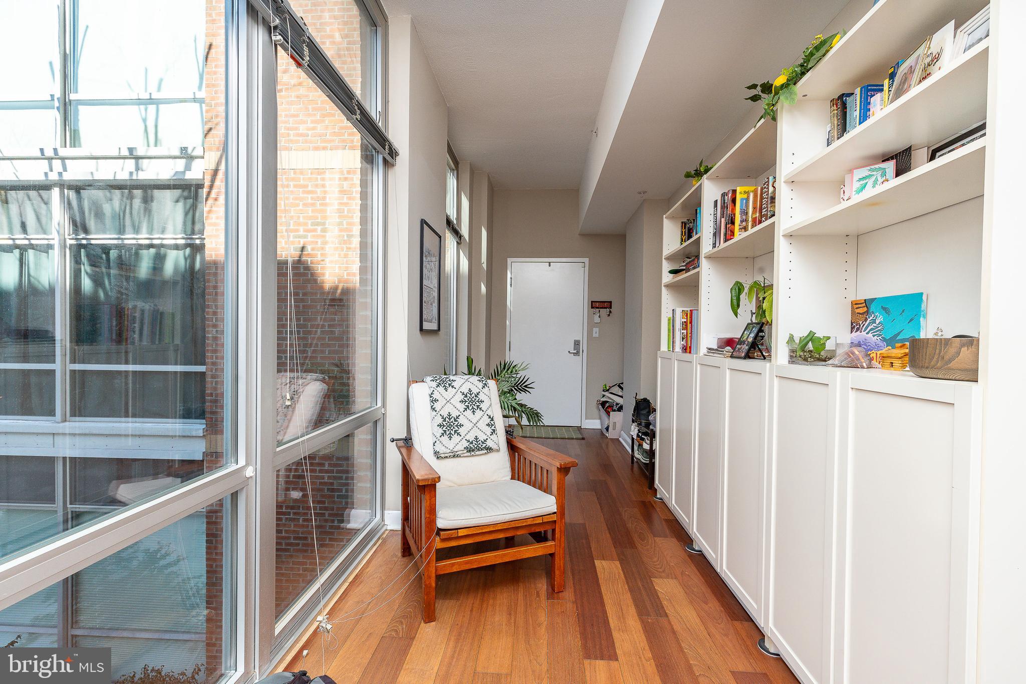 22 South Front Street, Unit 207 Philadelphia, PA 19106 - Photo 16 of 32 a hallway with wooden floor and furniture