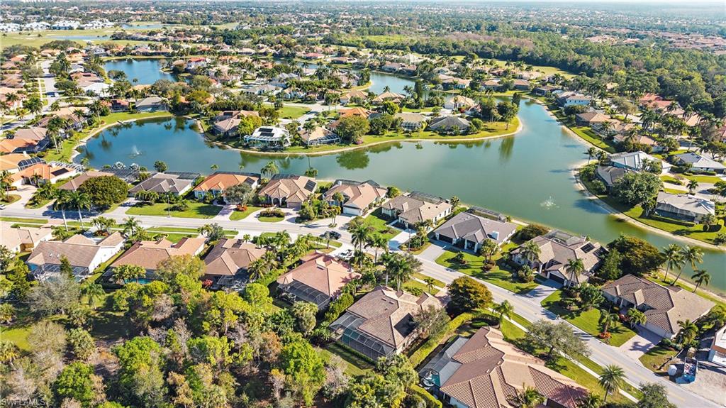 8856 Lely Island Circle Naples, FL 34113 - Photo 48 of 50 Aerial view of property's location with a nearby body of water and nearby suburban area