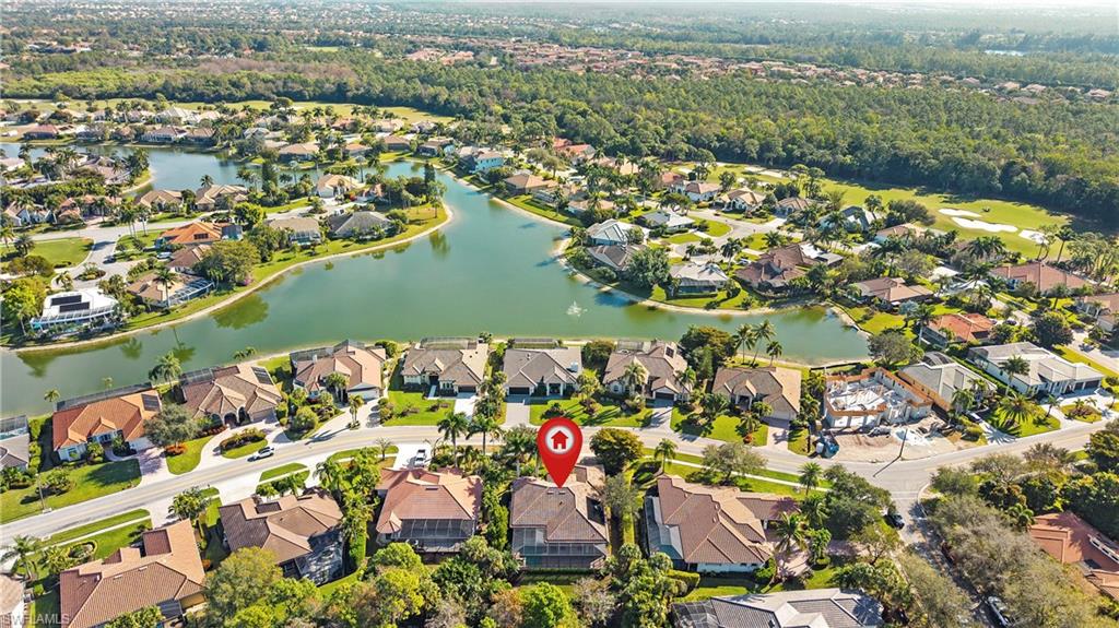 8856 Lely Island Circle Naples, FL 34113 - Photo 50 of 50 Aerial view of property and surrounding area with a nearby body of water and nearby suburban area