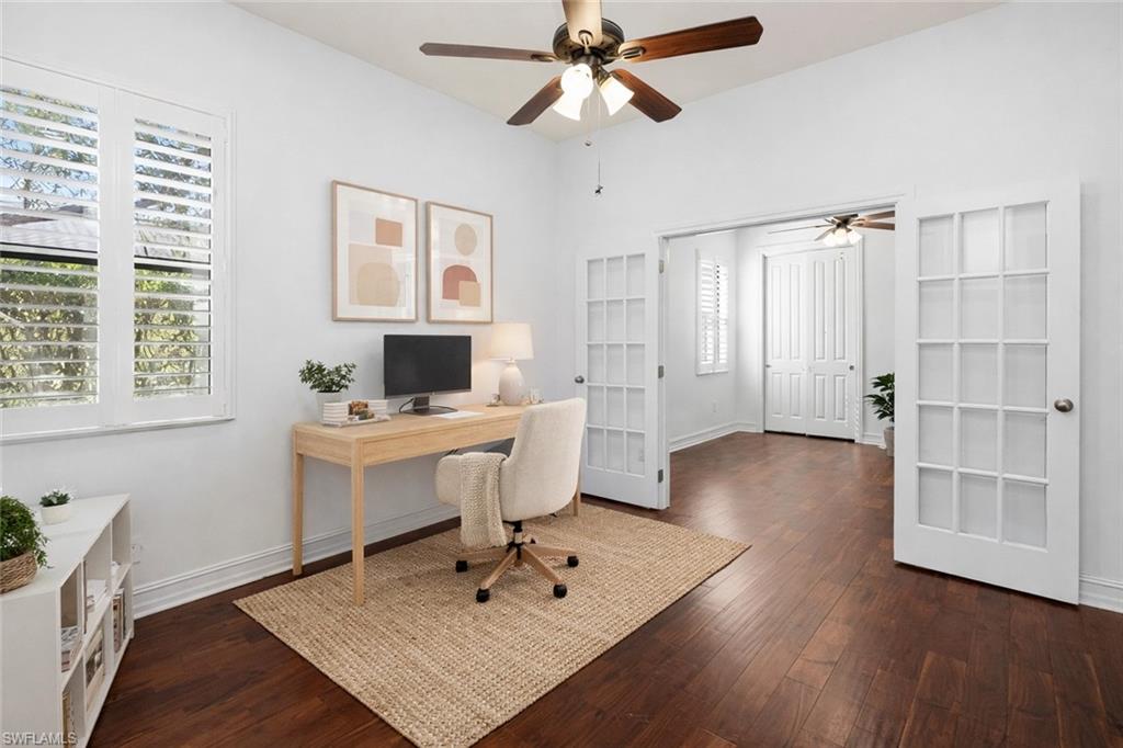 8856 Lely Island Circle Naples, FL 34113 - Photo 7 of 50 Virtually Staged Home office with a ceiling fan, dark wood-type flooring, and french doors