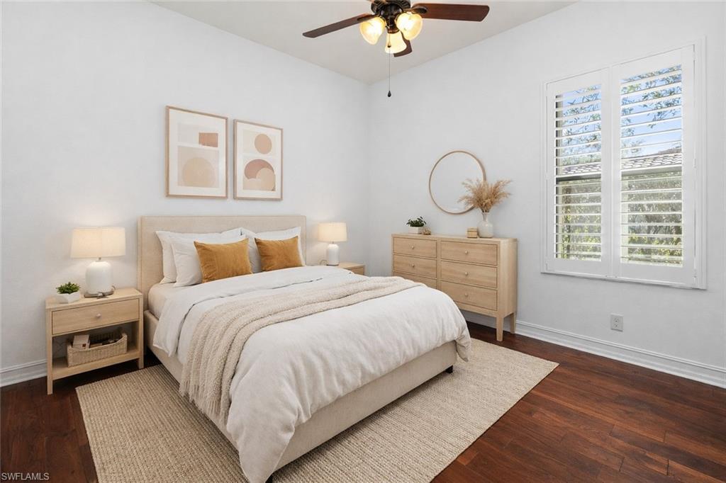 8856 Lely Island Circle Naples, FL 34113 - Photo 8 of 50 Virtually Staged Bedroom featuring dark wood-style flooring and a ceiling fan