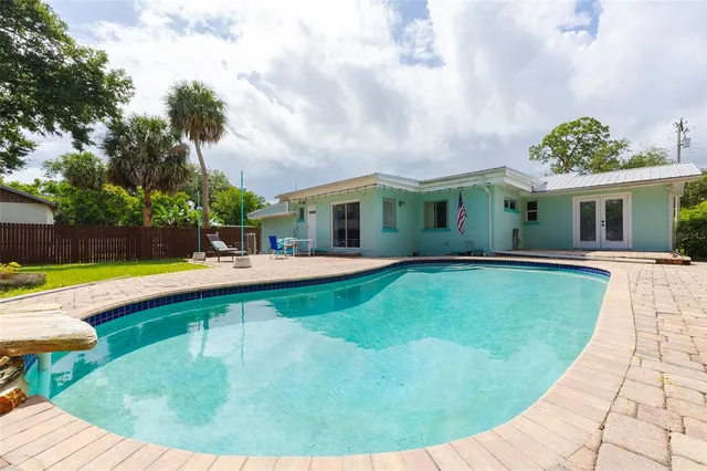a view of a house with swimming pool
