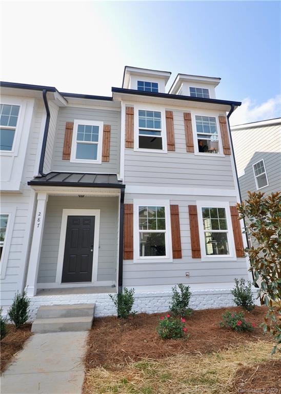 235 Keener Boulevard Belmont, NC 28012 - Photo 2 of 29 a front view of a house with a yard and garage