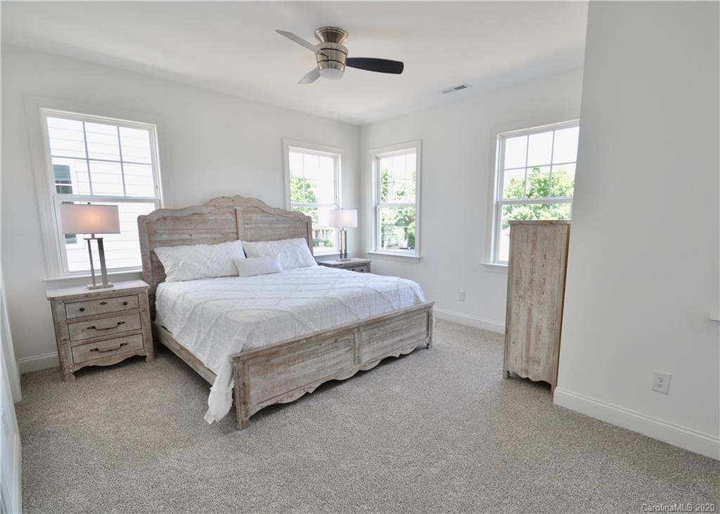 235 Keener Boulevard Belmont, NC 28012 - Photo 11 of 29 a bedroom with a bed and a window