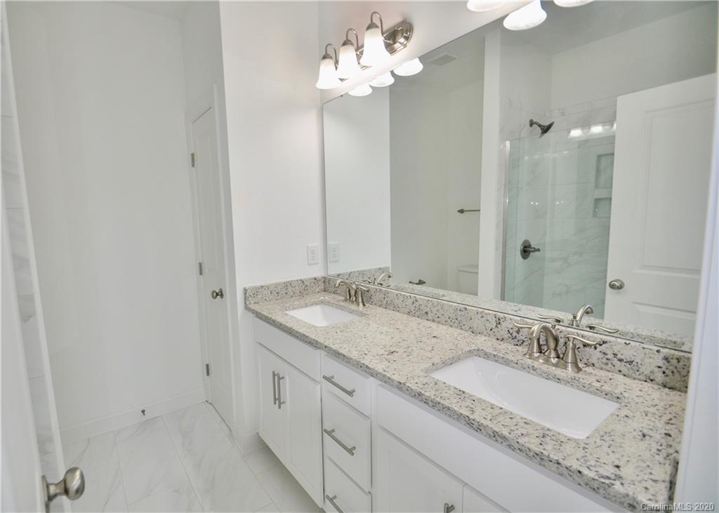 235 Keener Boulevard Belmont, NC 28012 - Photo 14 of 29 a bathroom with a granite countertop double vanity sink and shower
