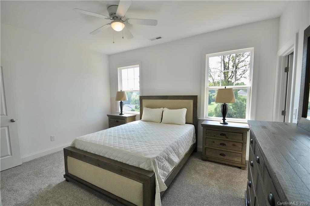 235 Keener Boulevard Belmont, NC 28012 - Photo 19 of 29 a bedroom with a bed and a window