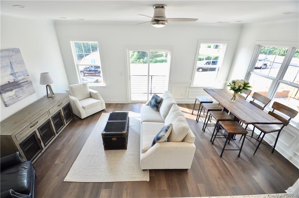235 Keener Boulevard Belmont, NC 28012 - Photo 3 of 29 a living room with furniture and a wooden floor