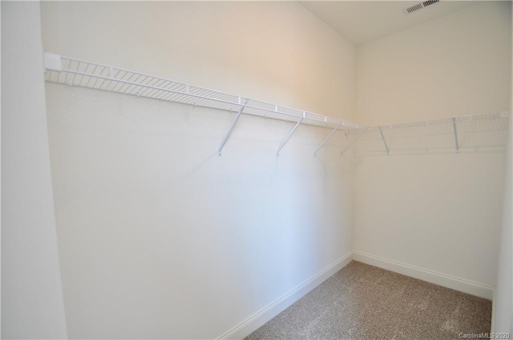 235 Keener Boulevard Belmont, NC 28012 - Photo 21 of 29 a view of a room with racks on the wall