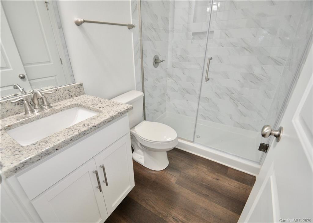 235 Keener Boulevard Belmont, NC 28012 - Photo 10 of 29 a bathroom with a granite countertop sink toilet and shower