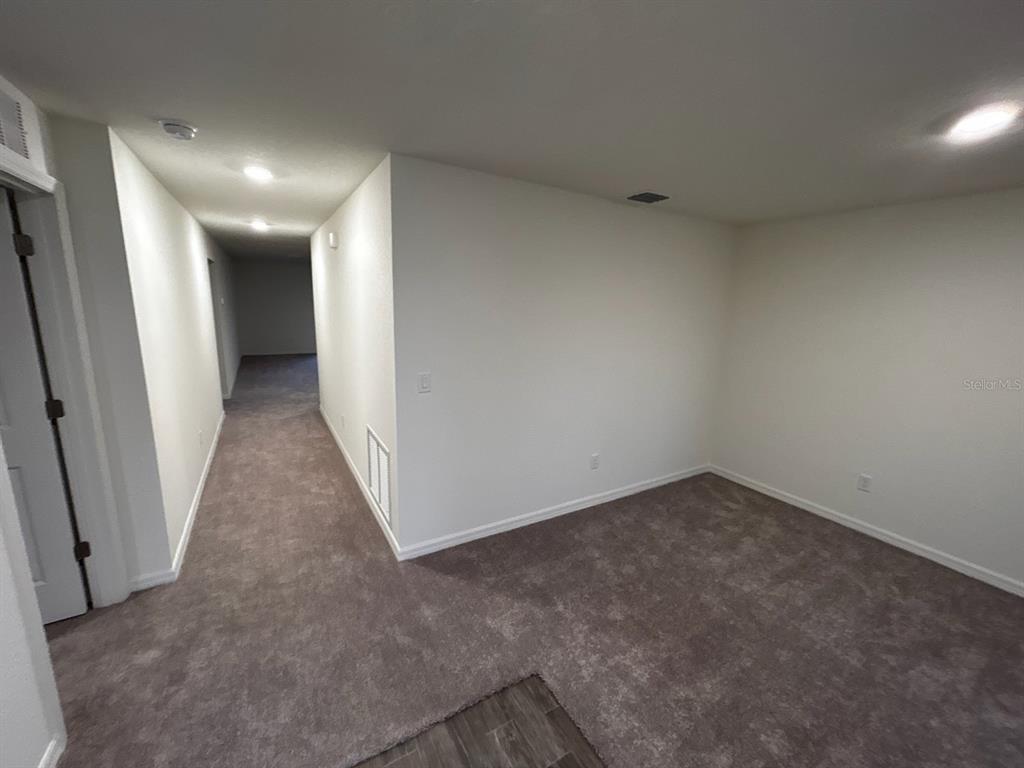 136 Sea Trail Palm Coast, FL 32164 - Photo 12 of 29 a view of a big room with a hallway