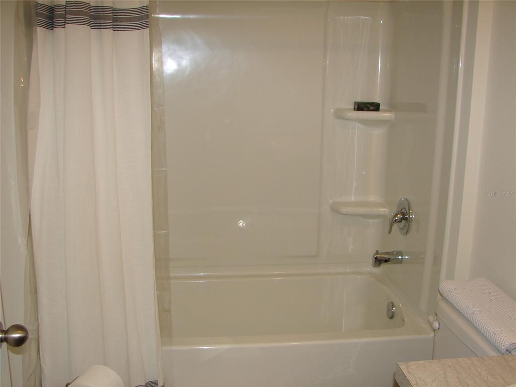 136 Sea Trail Palm Coast, FL 32164 - Photo 17 of 29 a bathroom with a bathtub
