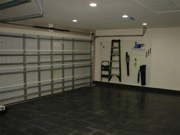 a swimming pool with outdoor seating and yard