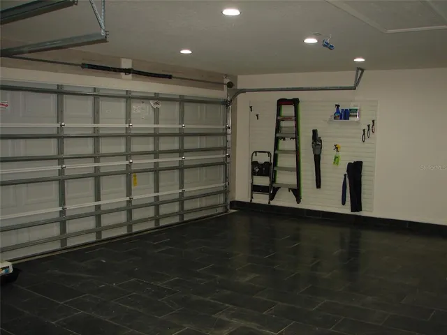 a swimming pool with outdoor seating and yard