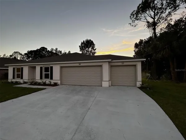 front view of a house with a garden