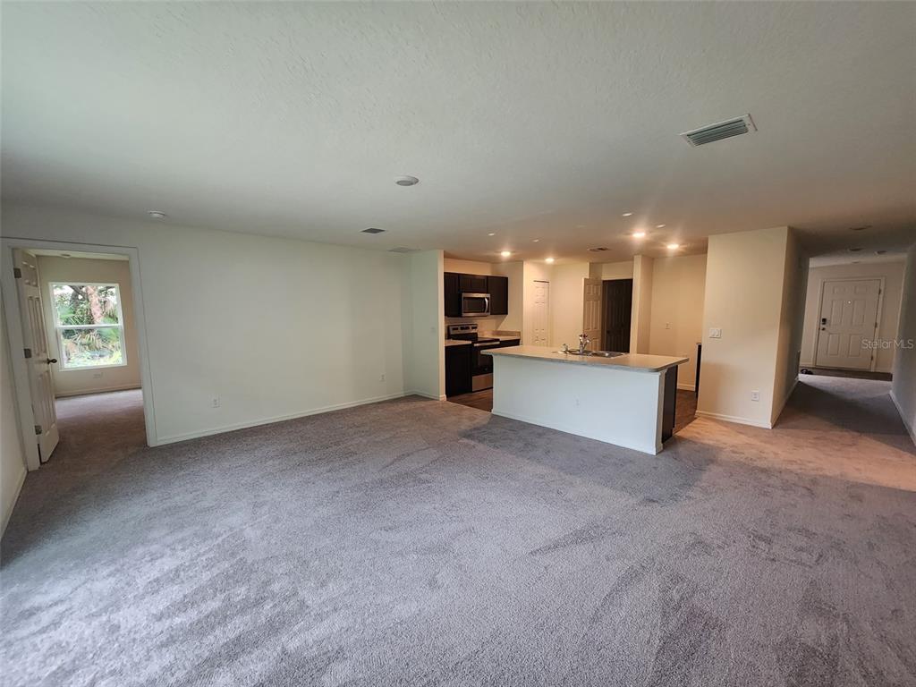 136 Sea Trail Palm Coast, FL 32164 - Photo 28 of 29 a view of a kitchen with a sink and a stove top oven