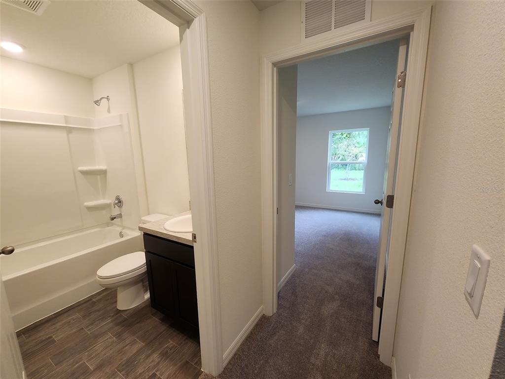 136 Sea Trail Palm Coast, FL 32164 - Photo 29 of 29 a bathroom with a sink toilet and shower