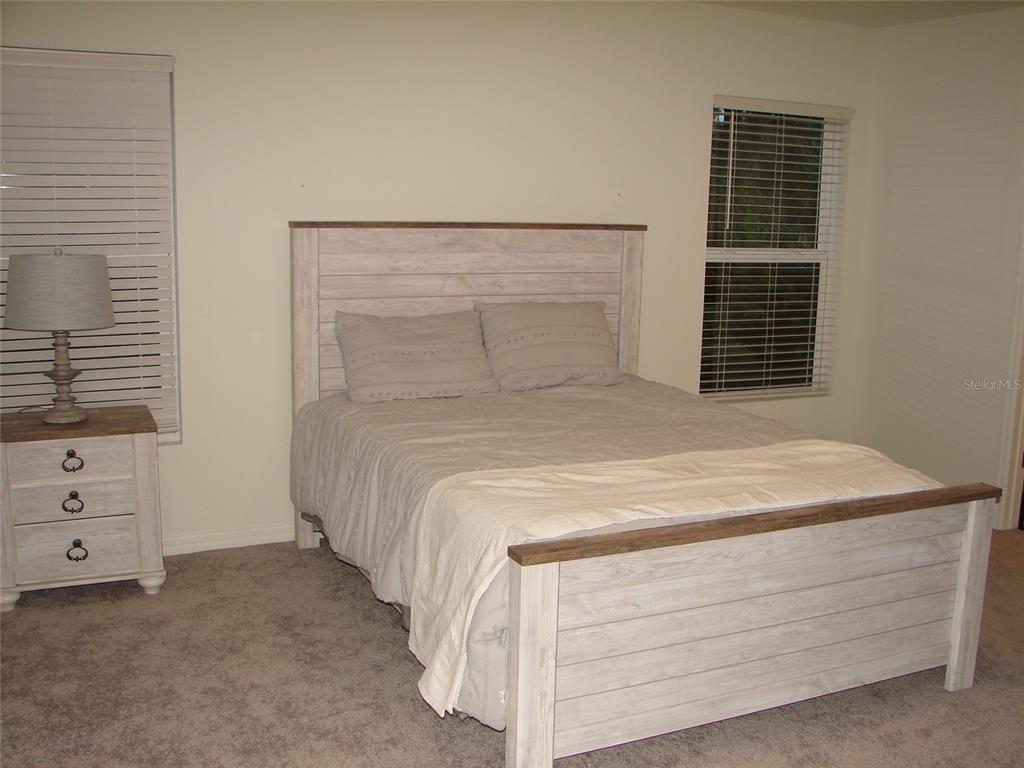 136 Sea Trail Palm Coast, FL 32164 - Photo 10 of 29 a bedroom with a bed and a window