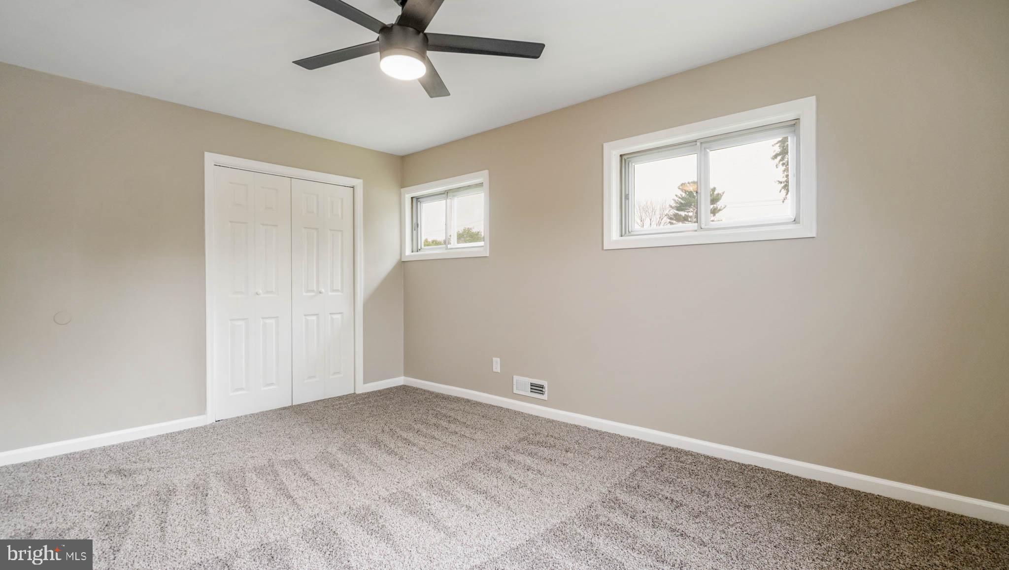 5932 Charnwood Road Baltimore, MD 21228 - Photo 9 of 21 a view of an empty room with a window