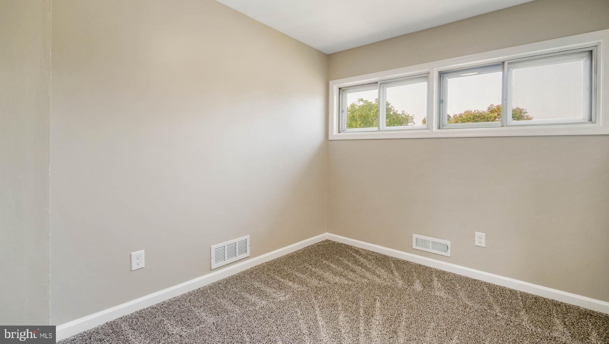 5932 Charnwood Road Baltimore, MD 21228 - Photo 10 of 21 an empty room with a window
